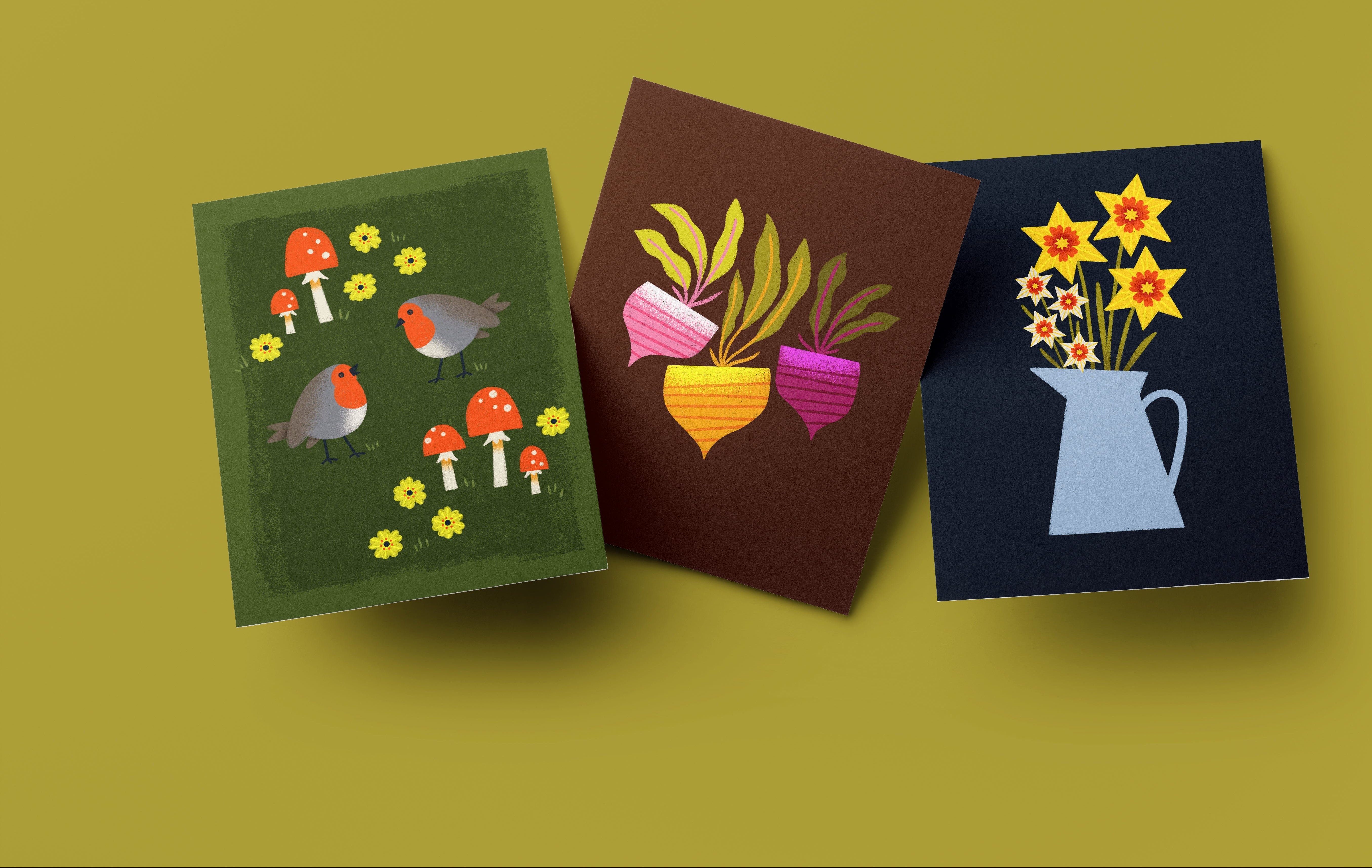 Three colorful greeting cards with nature-themed illustrations on a yellow background
